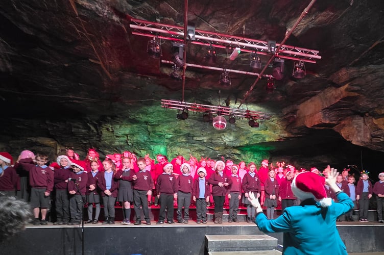 Children singing Christmas a host of classics at the picturesque Carnglaze Caverns