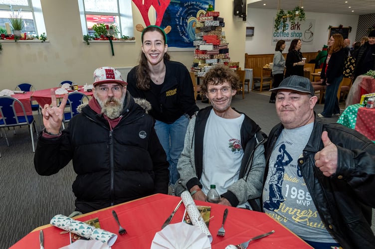 Harbour clients, volunteers and residents ready to enjoy their festive meal.