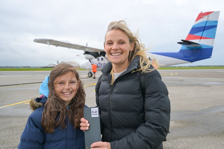 NEWQUAY AIRPORT, CORNWALL : December 20th 2025 : 2025 Pantomime Make a Wish campaign : Ella May arrives with her mother Zenna from the Isles of Scilly with her surprise tickets to see Aladdin at the Hall for Cornwall. Photographed for the Hall for Cornwall by Hugh Hastings.