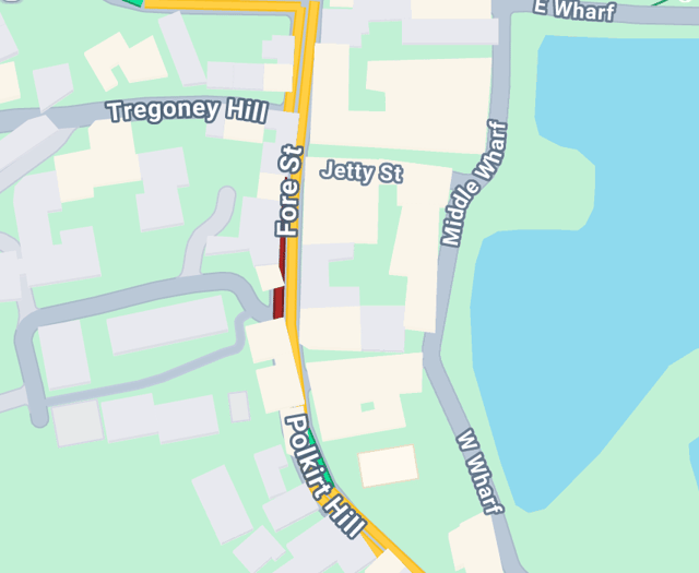 Road closed both ways after car collides with wall