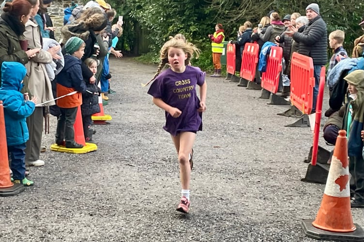 Millie O'Brien from Bishop Cornish School on her way to winning the Year 3/4 Girls race