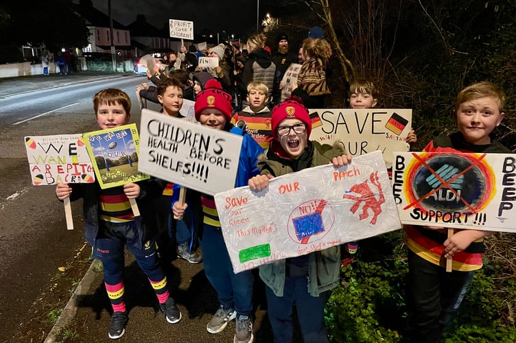 Youngsters from Saltash RFC lead the protest against proposals to build a new Aldi supermarket at Burraton Park