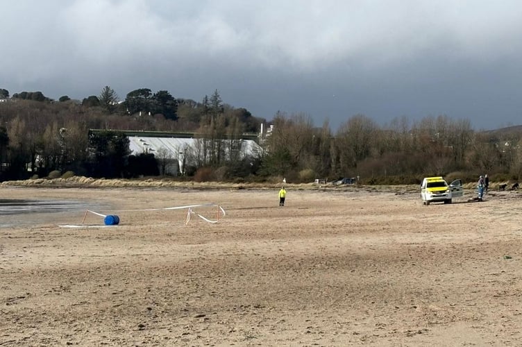 St Austell coastguards placed a cordon around the plastic drum on Par Beach for public safety. (Picture: St Austell Coastguard)