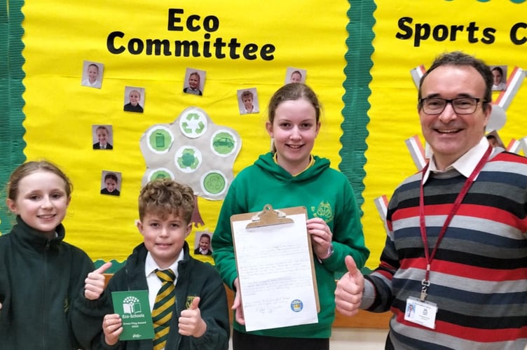 Sir Robert Geffery’s Primary School pupils Amelia, Sam and Imogen alongside headteacher Ed O'Hara