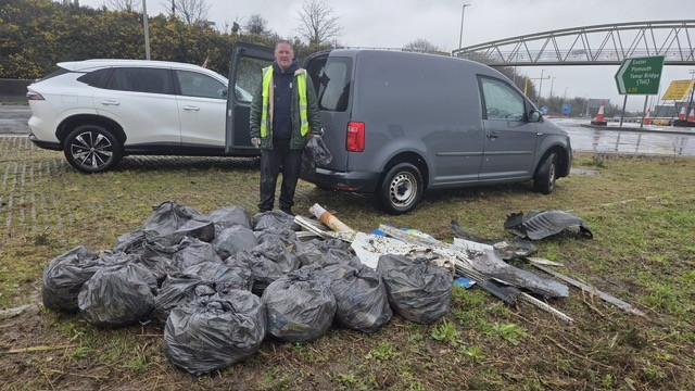 Councillor steps up to clear littered roundabout