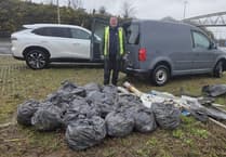 Councillor steps up to clear littered roundabout