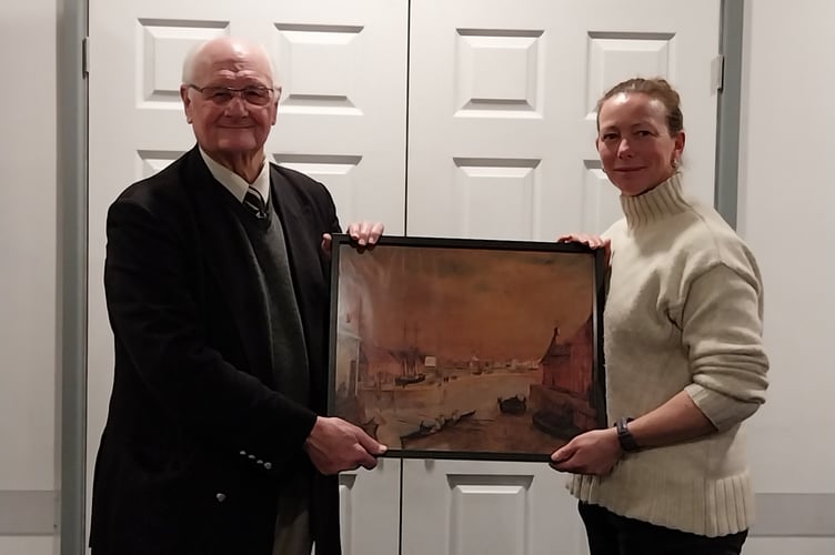 Barry Brooking presenting the framed print of Saltash rowing icon to Caradon Pilot Gig Rowing Club chairperson Naomi Philpott