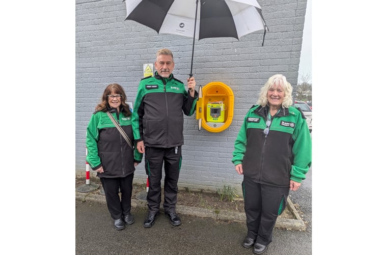 Ann McAuley, Tim Jones and Margaret Watts with the new defibrillator in St Austell.
