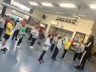 Champion athlete joins pupils for high-energy school challenge
