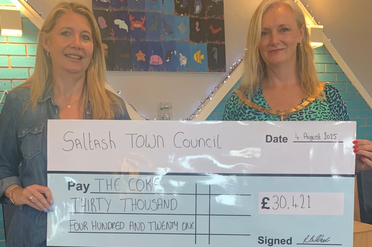 Charlotte Carpenter from The Core is presented with a cheque for £30,421 from Saltash Town Mayor, Cllr Rachel Bullock