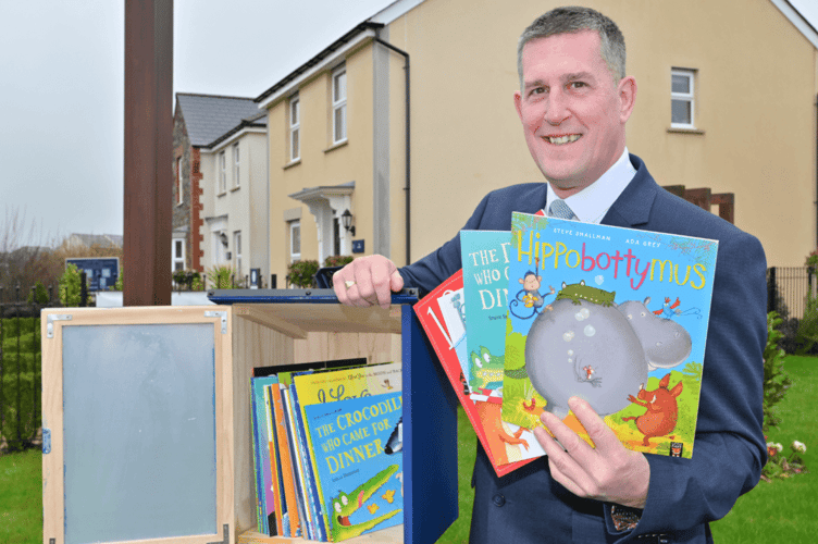 The mini library has been installed at the Treledan development by housebuilder David Wilson Homes