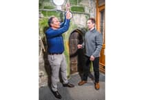 Entertainer Johnny Cowling has a go at bellringing during celebration in Cornwall