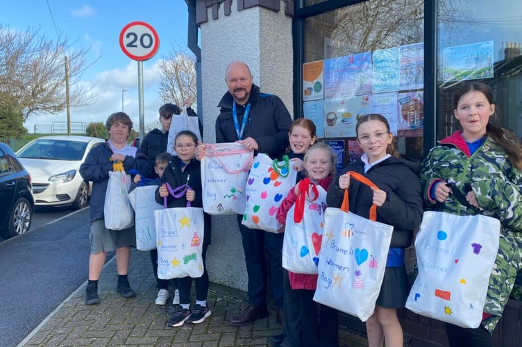 Brunel Primary School headteacher Darren Woolner with members of the school council dropping off their 'Warmer Bags' at the Wesley Methodist Church