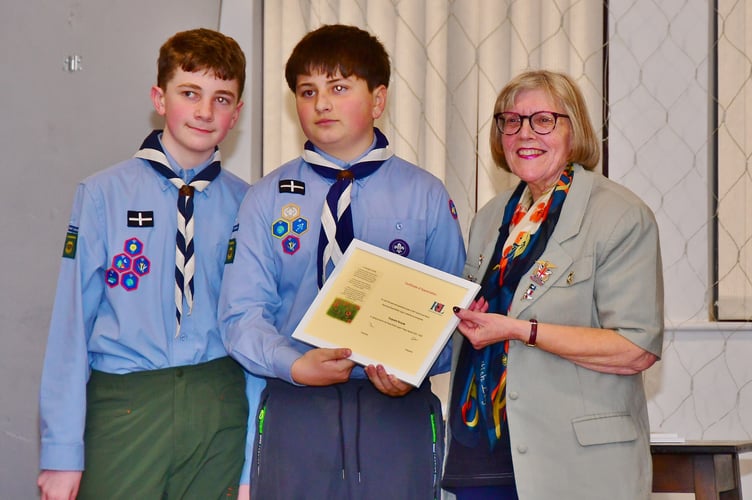 Youngsters from 2nd Torpoint Scouts are presented with their certificate by RBL Vice Chairman Rosemary Southworth