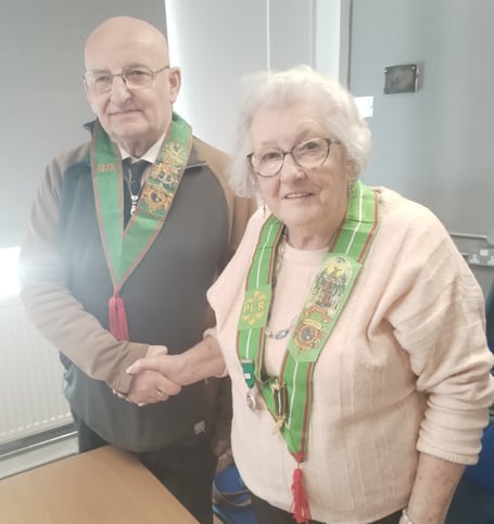 Outgoing Chief Ranger Sis Joan Thomas hands over to Bro Kevin Wadland of Launceston