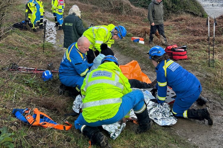 HM Coastguard recuing an orthopaedic surgeon who broke his ankle on a coastal walk. // An orthopaedic surgeon who broke his ankle on a coastal walk had to be rescued by the coastguard. Professor Chris Lavy, an NHS consultant and surgeon, has treated hundreds of of injuries - but unexpectedly became a casualty himself while walking in South Cornwall. Chris, from Oxford, was on a four-day walking trip on the South West coast path with his dog and eight friends. On an overcast day in January, they were walking between the villages of Par and Fowey and despite being well-equipped for wet conditions, the walk took a sudden turn.