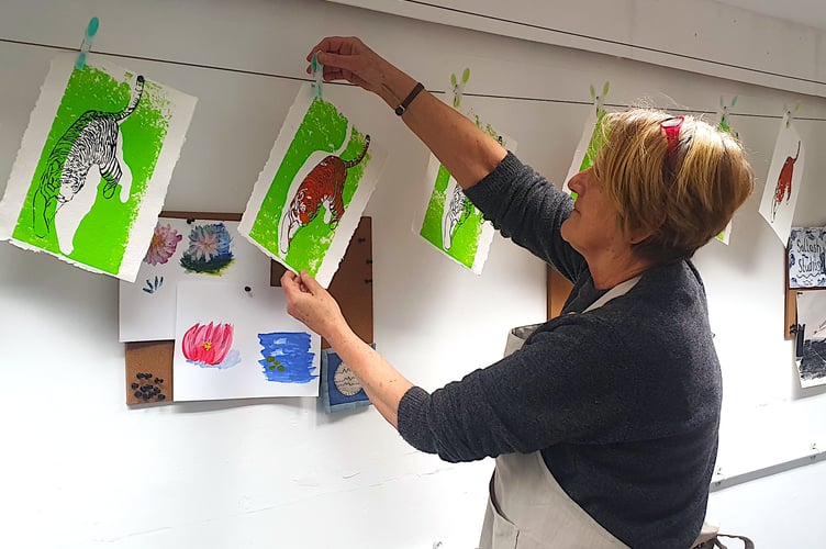 Local artist Karon Matten drying prints at Saltash Studios