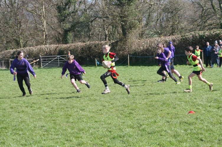 Skillful running in possession at Tavistock Area Schools Tag Rugby tournament.