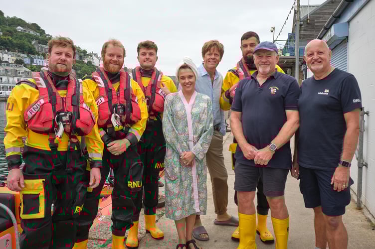 The Looe RNLI crew pictured cast members, Kris Marshall and Sally Bretton, from the BBC series Beyond Paradise (Picture: BBC/Red Planet Productions)
