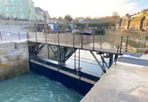People delight in using the new lock gate bridge at Charlestown in Cornwall
