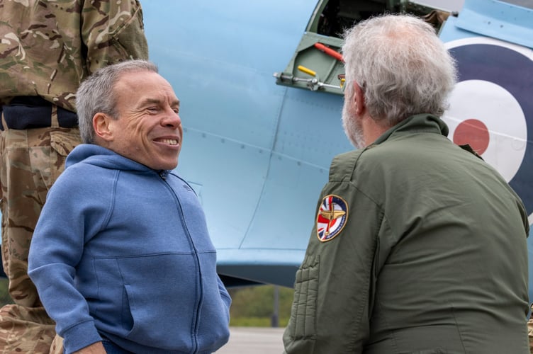 Image shows actor Warwick Davis in conversation witb passenger for this leg, Mr Ian Wood after landing at Cornwall Airport Newquay.
A historic RAF Spitfire touched down in Cornwall today as part of the nationwide Spitfire 90 Tour, marking 90 years since the iconic aircraftâs first flight and raising funds for two important RAF charities.
The legendary aircraft arrived at Cornwall Airport Newquay (CAN) at 1148 hrs on Thursday 16 April, drawing aviation enthusiasts, personnel and special guests eager to witness a living piece of British history.
The visit formed part of the Spitfire 90 Tour, delivered by Spitfire.com and supported by the Battle of Britain Memorial Flight. The tour commemorates the Spitfireâs first flight in 1936 and aims to raise funds for both the Mark Long Trust and the RAF Benevolent Fund, supporting serving personnel, veterans and their families.
Despite bestlaid plans, unpredictable weather required adjustments to the flying
programme, resulting in the Cornwall visit taking place on Thursday 16 April rather than the originally advertised date, Wednesday 15 April. The changes highlighted the complexities of operating historic aircraft and the importance of safety led decision making.
Among those fortunate enough to witness the Spitfire on the ground was BAFTA
awardwinning actor Warwick Davis.