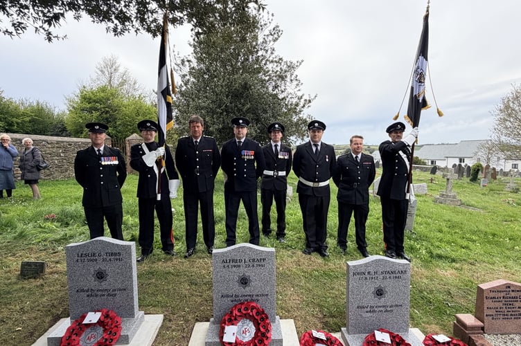 Current serving members of Saltash Community Fire Station pay their respects alongside the restored graves