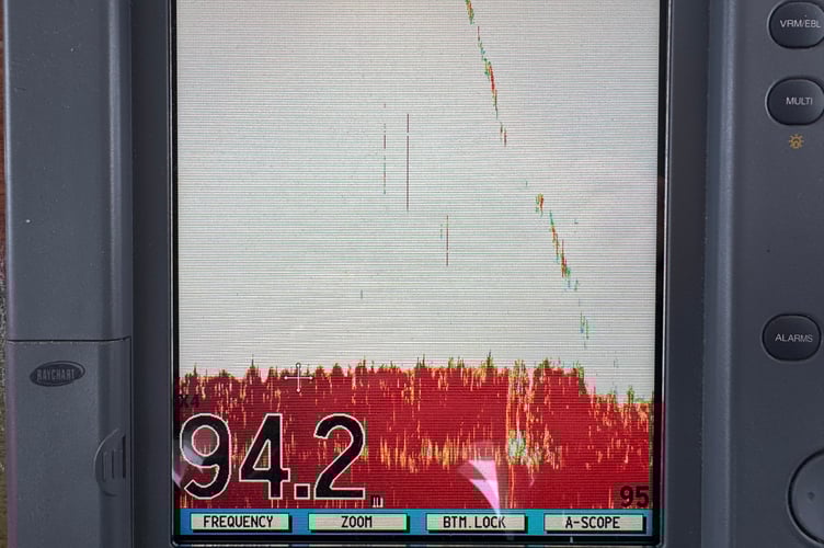A still of the sonar of the TAMPA, which also shows the divers descending to the wreck at 94 metres