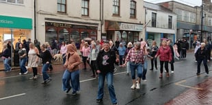 Rain can’t stop dancers in flash mob spectacle