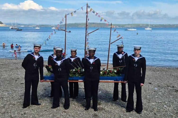 The flower-covered Black Prince boat was carried through the villages by naval ratings from HMS Raleigh (Picture: HMS Raleigh)