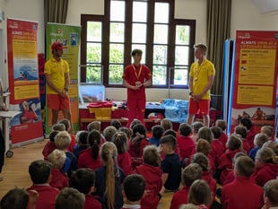 RNLI lifeguards provide pupils with water safety advice