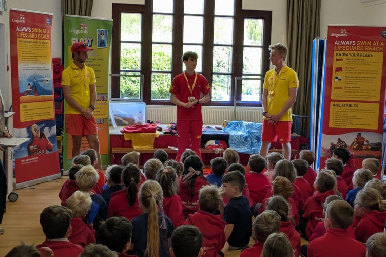 RNLI lifeguards delivering a water smart education session (Picture: RNLI/Burton Bradstock School)