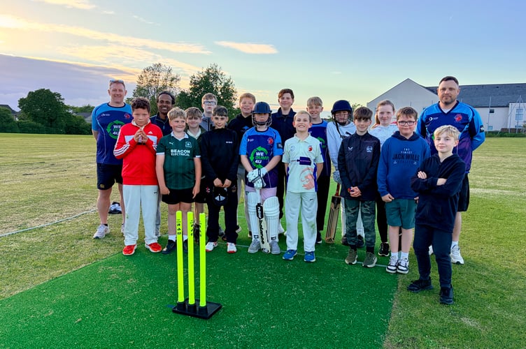 Youngsters and coaches from Saltash Cricket Club making the most of the new non-turf wicket at Chapel Field 