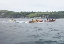 Pair rescued from sinking jet-ski in St Austell Bay