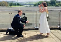 Pass out parade ends with surprise proposal at naval base