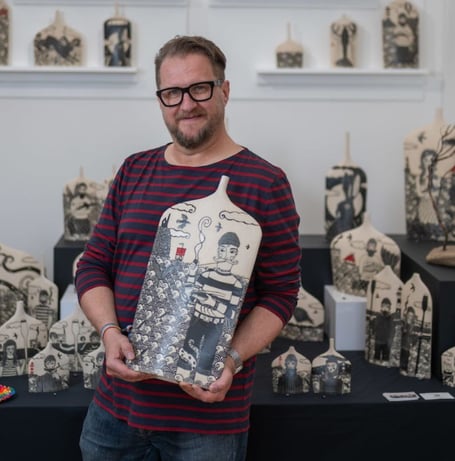 Russell Martin creates detailed illustrations by carving through layers of clay to reveal striking designs inspired by Cornwall's landscapes, wildlife and heritage