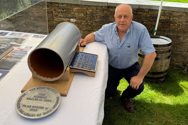Local historian Barry West pictured alongside the time capsule, which was filled with various artefacts relating to Emily