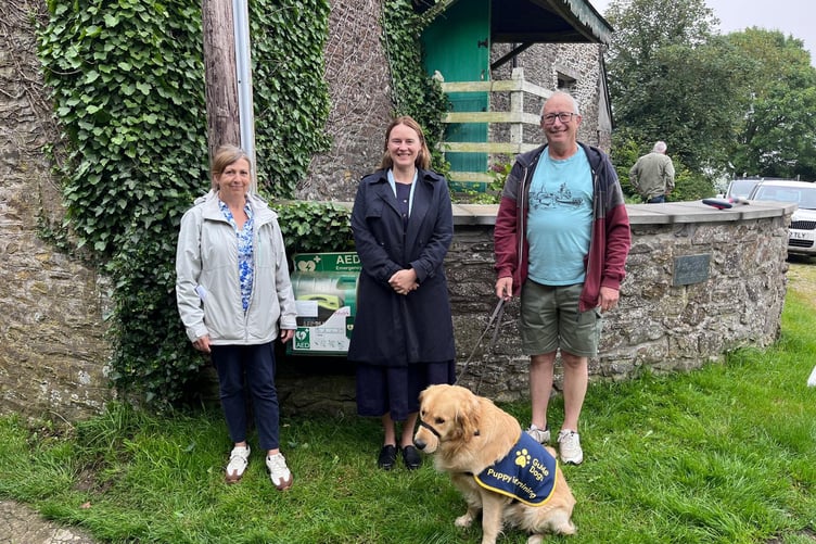 South East Cornwall MP, Anna Gelderd, alongside representatives from Sheviock Parish Council outside of the Tredis defibrillator