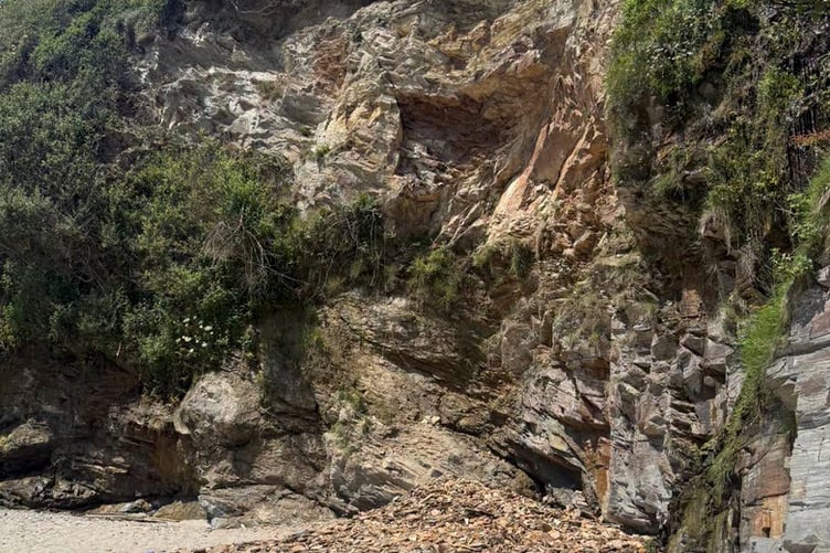 Part of a cliff at Duporth beach gave way sending debris onto the sands below. (Picture: St Austell Coastguard)