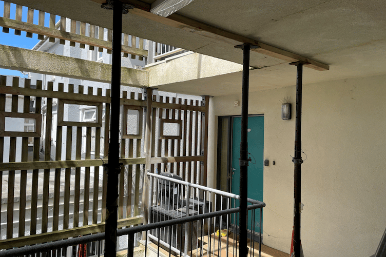 Structural supports have appeared around parts of the building to hold up balconies and walkways
