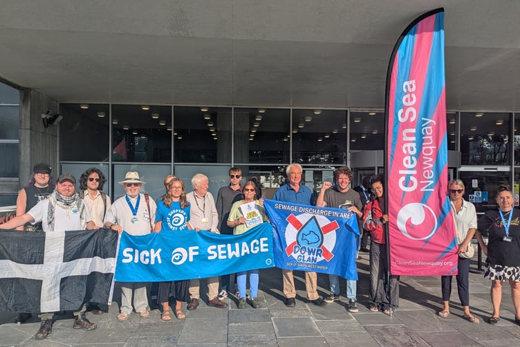 Campaigners staged a rally outside County Hall to highlight the impact of the sewage crisis ahead of the vote (Picture: Warren Wilkins)