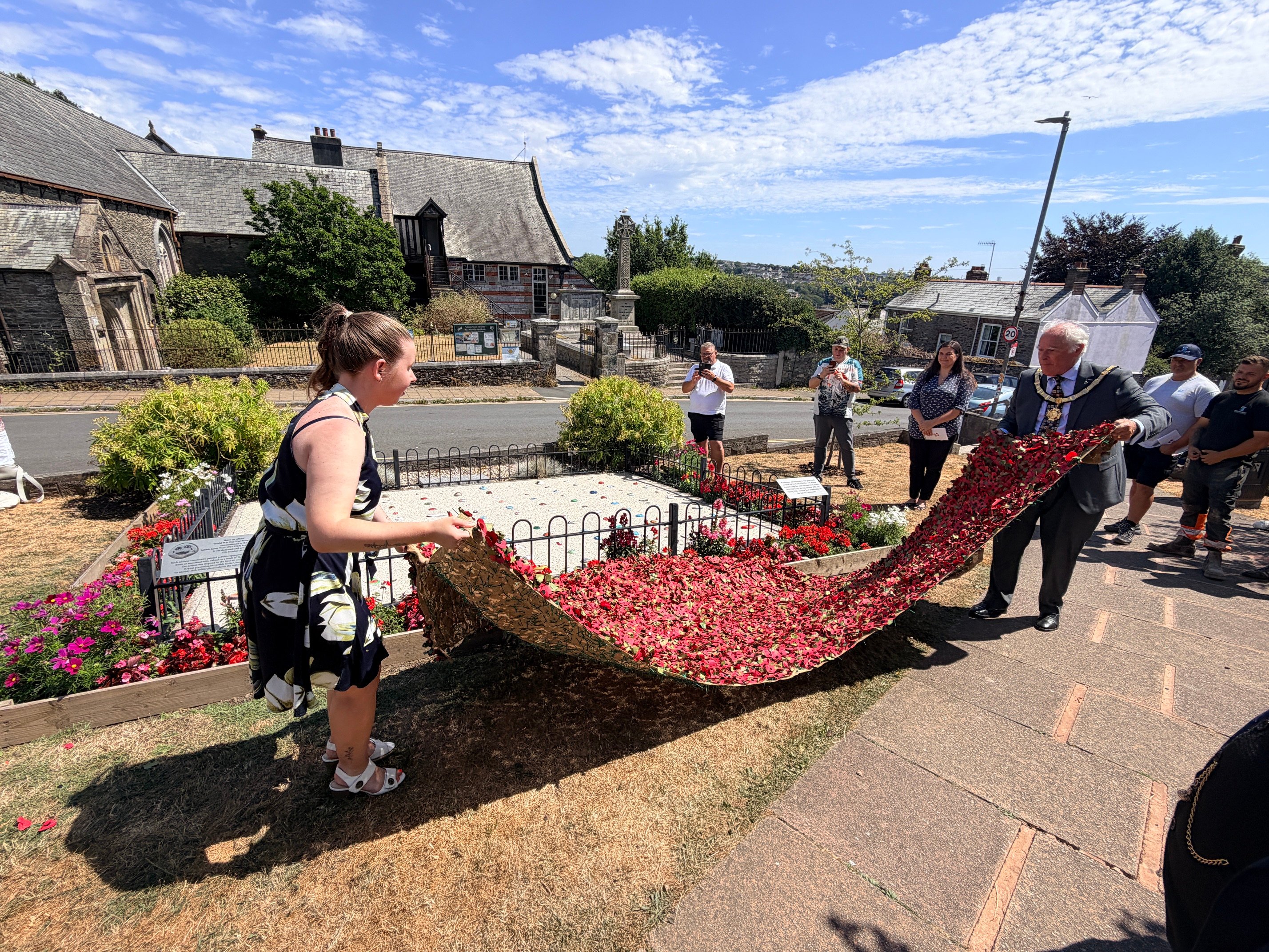 Krystal Read and Saltash Mayor, Cllr Brian Stoyel, officially unveil the restored Pebble Memorial