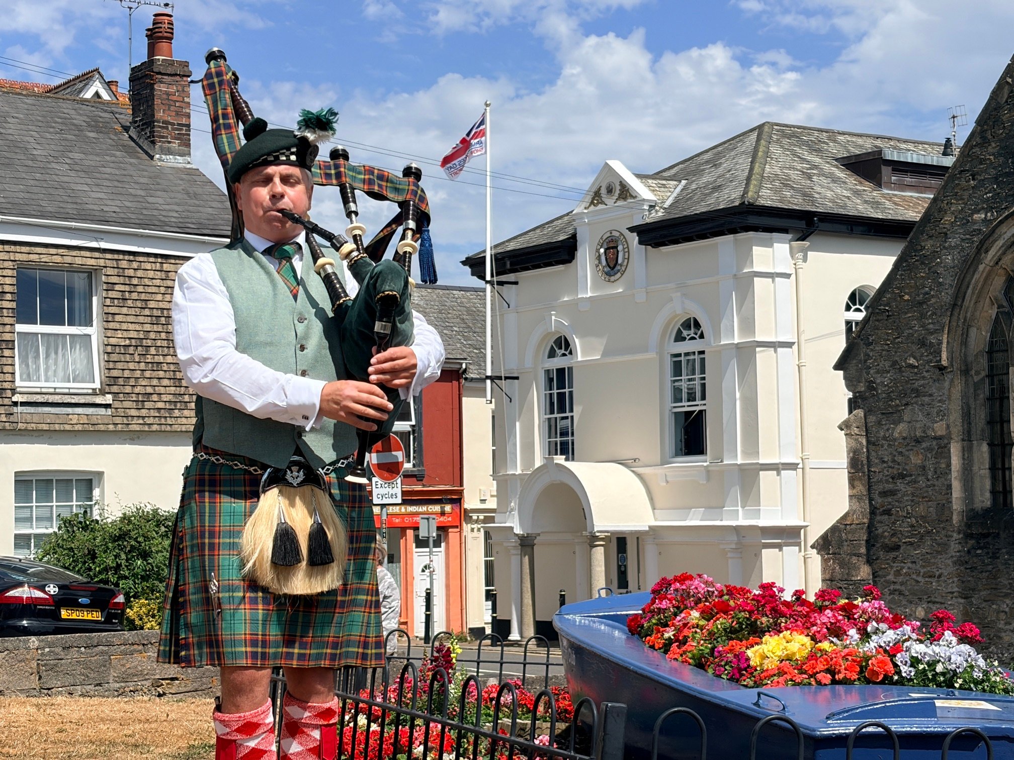 Piper David Parry plays at the Saltash Pebble Memorial Restoration Unveiling Ceremony in Alexandra Square