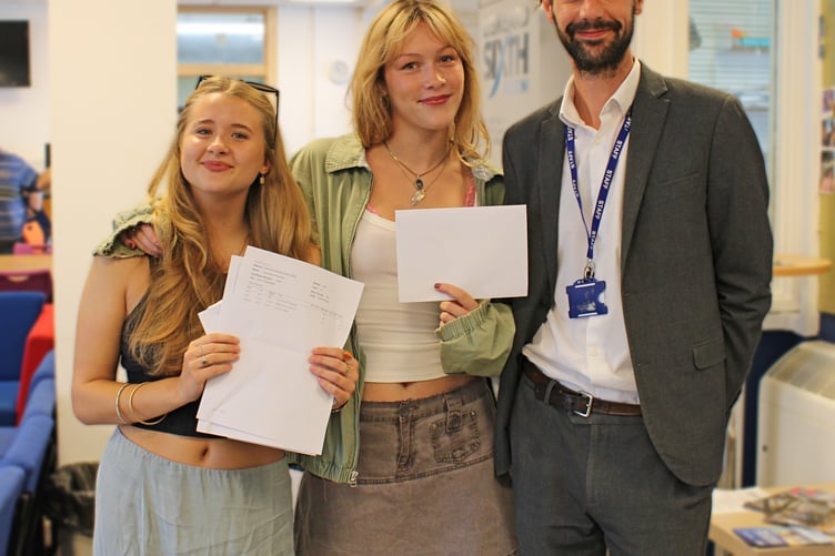 Liskeard Head Teacher Dan Weldon alongside two of his students on A Level results day