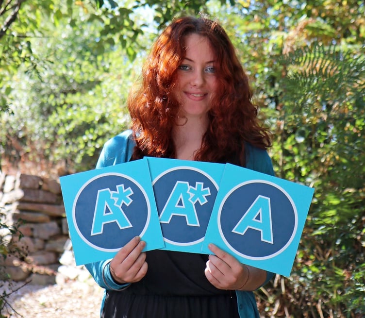 Callywith College student Agnes Wilkinson proudly shows off her results