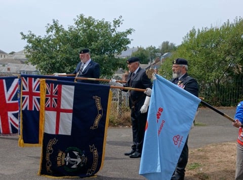 Standard bearers pay their respects during Sunday's VJ Day service of remembrance in Liskeard