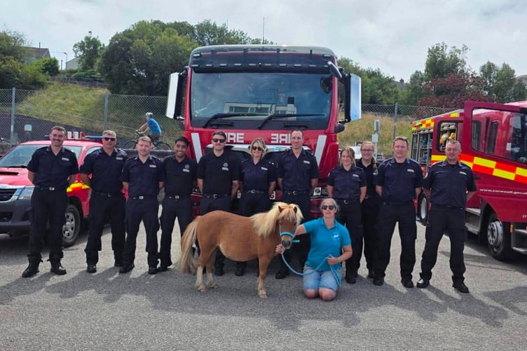 Bodmin's fire fighting heroes pictured with Amy and one of Little Margate's miniature ponies (Picture: Little Margate Therapy Ponies)
