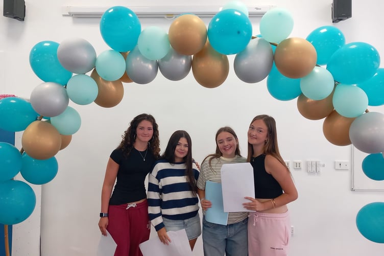 Saltash Community School students gathered under a balloon arch specially crafted for their GCSE results day