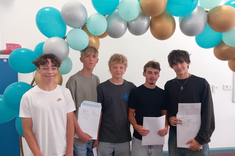 Students came together to support each other as they opened those all important envelopes