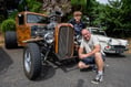 Classic cars on show while rock and roll plays