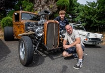 Classic cars on show while rock and roll plays